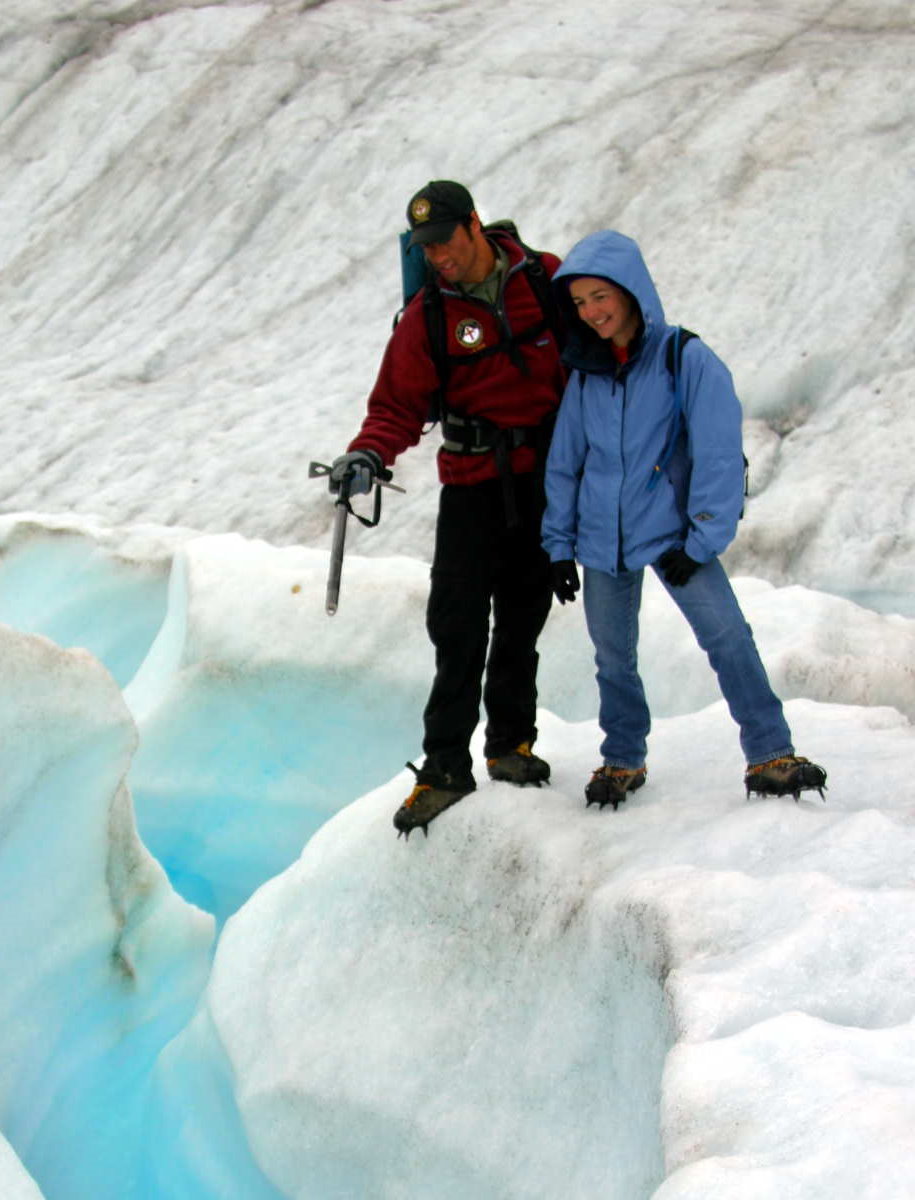 People hiking on a glacier